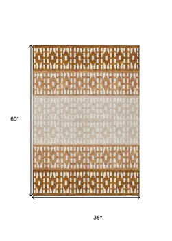 3' X 5' Orange Beige And Ivory Geometric Washable Indoor Outdoor Area Rug