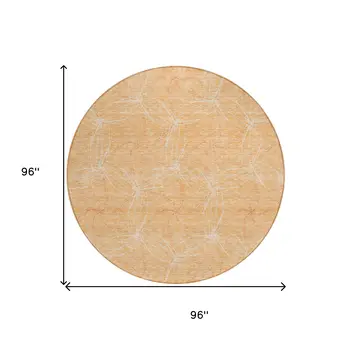 8' Peach And Ivory Round Geometric Washable Indoor Outdoor Area Rug