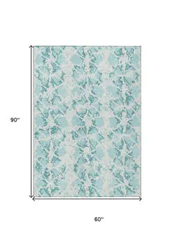 5' X 8' Teal Blue And Ivory Abstract Washable Indoor Outdoor Area Rug