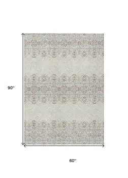 5' X 8' Ivory And Taupe Tribal Washable Indoor Outdoor Area Rug