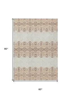5' X 8' Orange And Ivory Tribal Washable Indoor Outdoor Area Rug