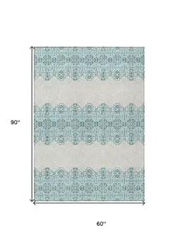 5' X 8' Teal Blue And Ivory Tribal Washable Indoor Outdoor Area Rug