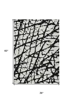 3' X 5' Black And Ivory Abstract Washable Indoor Outdoor Area Rug