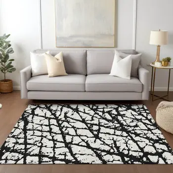 5' X 8' Black And Ivory Abstract Washable Indoor Outdoor Area Rug