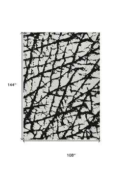 9' X 12' Black And Ivory Abstract Washable Indoor Outdoor Area Rug