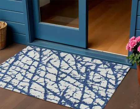 3' X 5' Navy Blue And Ivory Abstract Washable Indoor Outdoor Area Rug