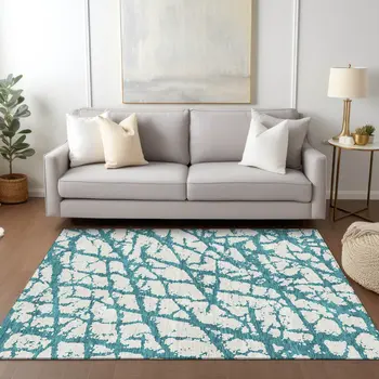 8' X 10' Teal Blue And Ivory Abstract Washable Indoor Outdoor Area Rug