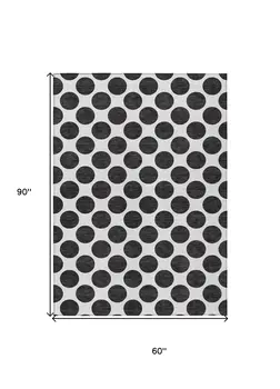 5' X 8' Black And Ivory Polka Dot Washable Indoor Outdoor Area Rug