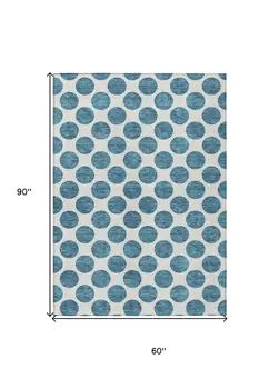 5' X 8' Teal Blue And Ivory Polka Dot Washable Indoor Outdoor Area Rug