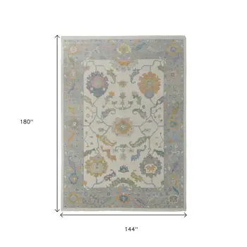 12' X 15' Ivory Orange And Blue Floral Hand Knotted Area Rug With Fringe