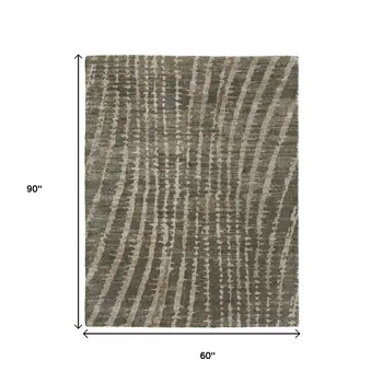5' X 8' Green And Tan Abstract Area Rug