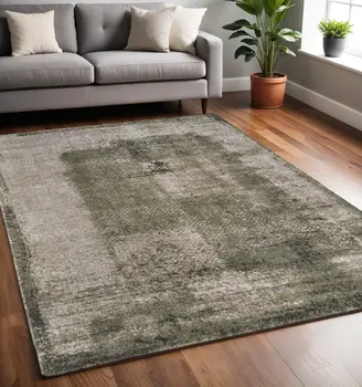 5' X 8' Green And Tan Abstract Distressed Area Rug