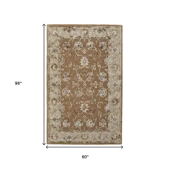 5' X 8' Tan And Ivory Floral Hand Tufted Area Rug