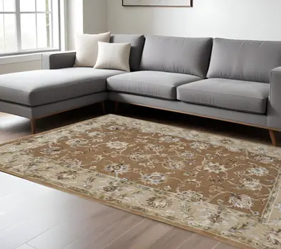 8' X 10' Tan And Ivory Floral Hand Tufted Area Rug