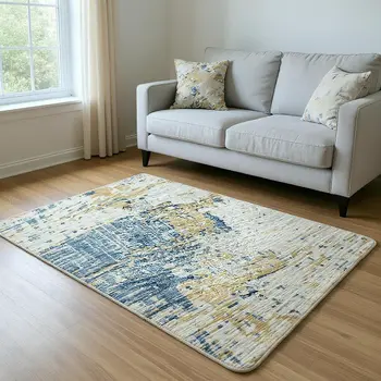 5' X 8' Blue Ivory And Gold Abstract Washable Area Rug With UV Protection