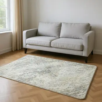 5' X 8' Ivory And Beige Abstract Washable Area Rug With UV Protection