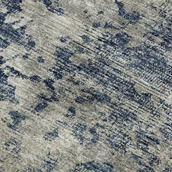 5' X 8' Blue And Ivory Abstract Washable Area Rug With UV Protection
