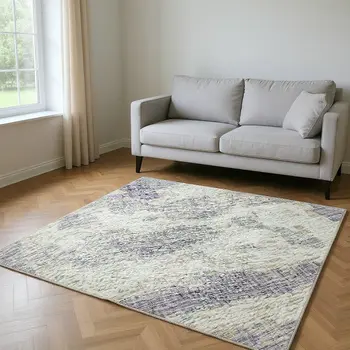 9' X 12' Purple And Ivory Abstract Washable Area Rug With UV Protection