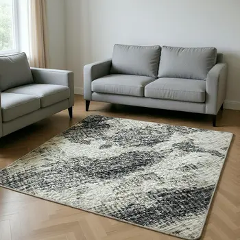 10' X 14' Black And Ivory Abstract Washable Area Rug With UV Protection