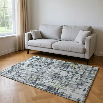 5' X 8' Gold Charcoal And Ivory Abstract Washable Area Rug With UV Protection