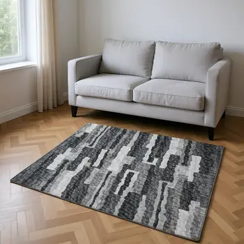 5' X 8' Graphite And Ivory Abstract Washable Area Rug With UV Protection