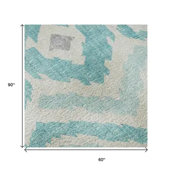 5' X 8' Aqua Ivory And Gold Tribal Washable Area Rug With UV Protection