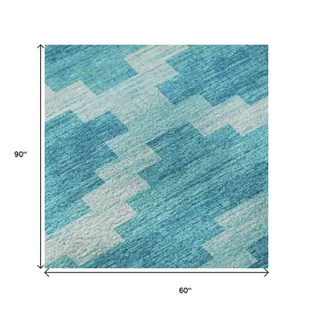5' X 8' Turquoise And Ivory Tribal Washable Area Rug With UV Protection
