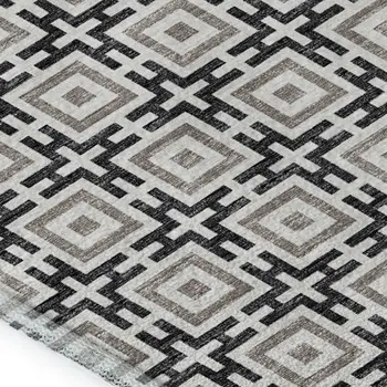 5' X 8' Black And Ivory Geometric Washable Area Rug With UV Protection
