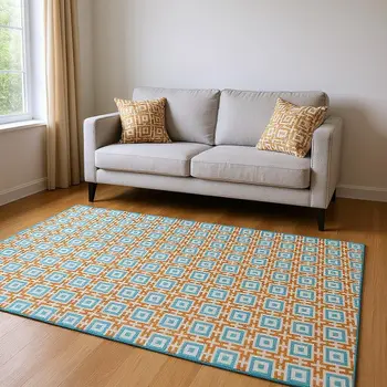 5' X 8' Orange And Teal Blue Geometric Washable Area Rug With UV Protection