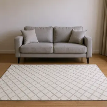 5' X 8' Ivory And Taupe Geometric Washable Area Rug With UV Protection
