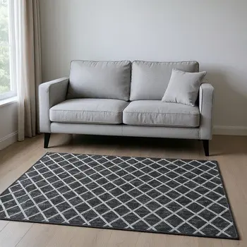 5' X 8' Black And Ivory Geometric Washable Area Rug With UV Protection