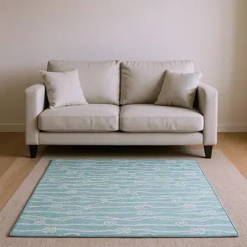 10' X 14' Teal Blue And Ivory Nautical Washable Area Rug With UV Protection