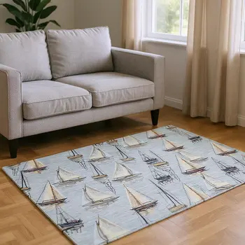 9' X 12' Sky Blue Gold And Ivory Nautical Washable Area Rug With UV Protection