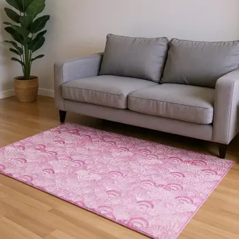 5' X 8' Pink And Ivory Geometric Washable Area Rug With UV Protection