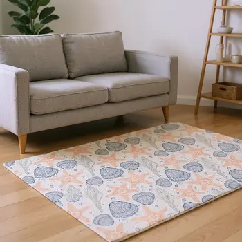 9' X 12' Peach Ivory And Navy Blue Geometric Washable Area Rug With UV Protection