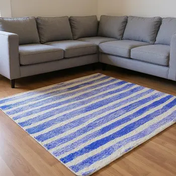 10' X 14' Blue And Ivory Geometric Washable Area Rug With UV Protection