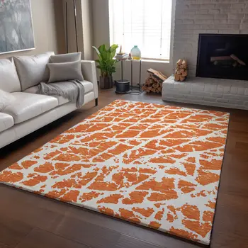 5' X 8' Orange And Ivory Abstract Washable Area Rug With UV Protection