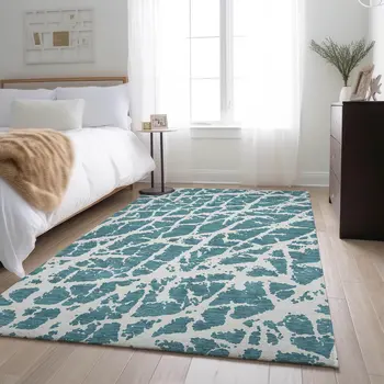 5' X 8' Teal And Ivory Abstract Washable Area Rug With UV Protection