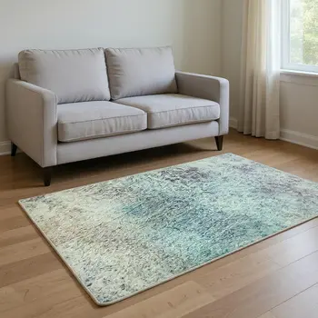 5' X 8' Blue Purple And Ivory Abstract Washable Area Rug With UV Protection