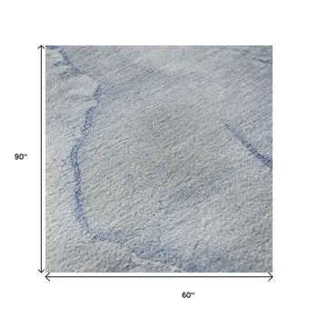 5' X 8' Blue And Ivory Abstract Washable Area Rug With UV Protection