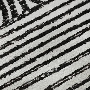 5' X 8' Black And Ivory Geometric Washable Area Rug With UV Protection