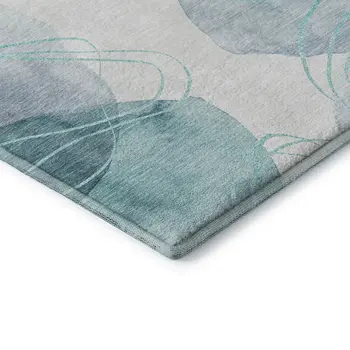 5' X 8' Teal And Ivory Abstract Washable Area Rug With UV Protection