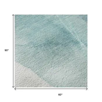 5' X 8' Teal And Ivory Abstract Washable Area Rug With UV Protection