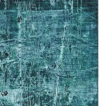 10' X 14' Teal And Ivory Abstract Washable Area Rug With UV Protection