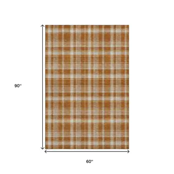5' X 8' Rust And Ivory Plaid Washable Area Rug With UV Protection