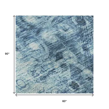 5' X 8' Blue And Ivory Ikat Washable Area Rug With UV Protection