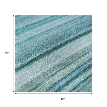5' X 8' Teal And Ivory Abstract Washable Area Rug With UV Protection