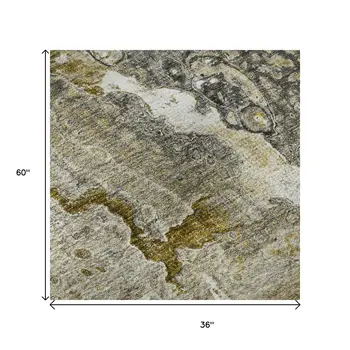 3' X 5' Taupe Ivory And Gold Abstract Washable Area Rug With UV Protection