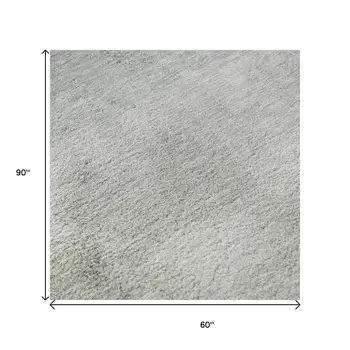 5' X 8' Beige And Ivory Abstract Washable Area Rug With UV Protection