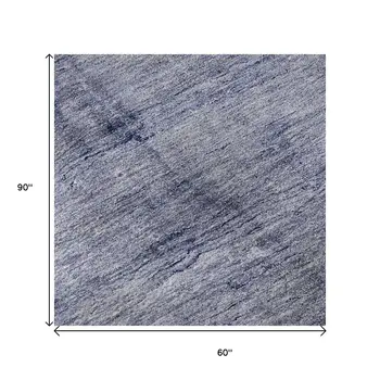 5' X 8' Navy Blue And Ivory Abstract Washable Area Rug With UV Protection